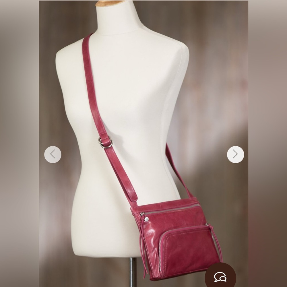HOBO brand Cassie crossbody color is “carmine” - dark pink/light red.  Leather